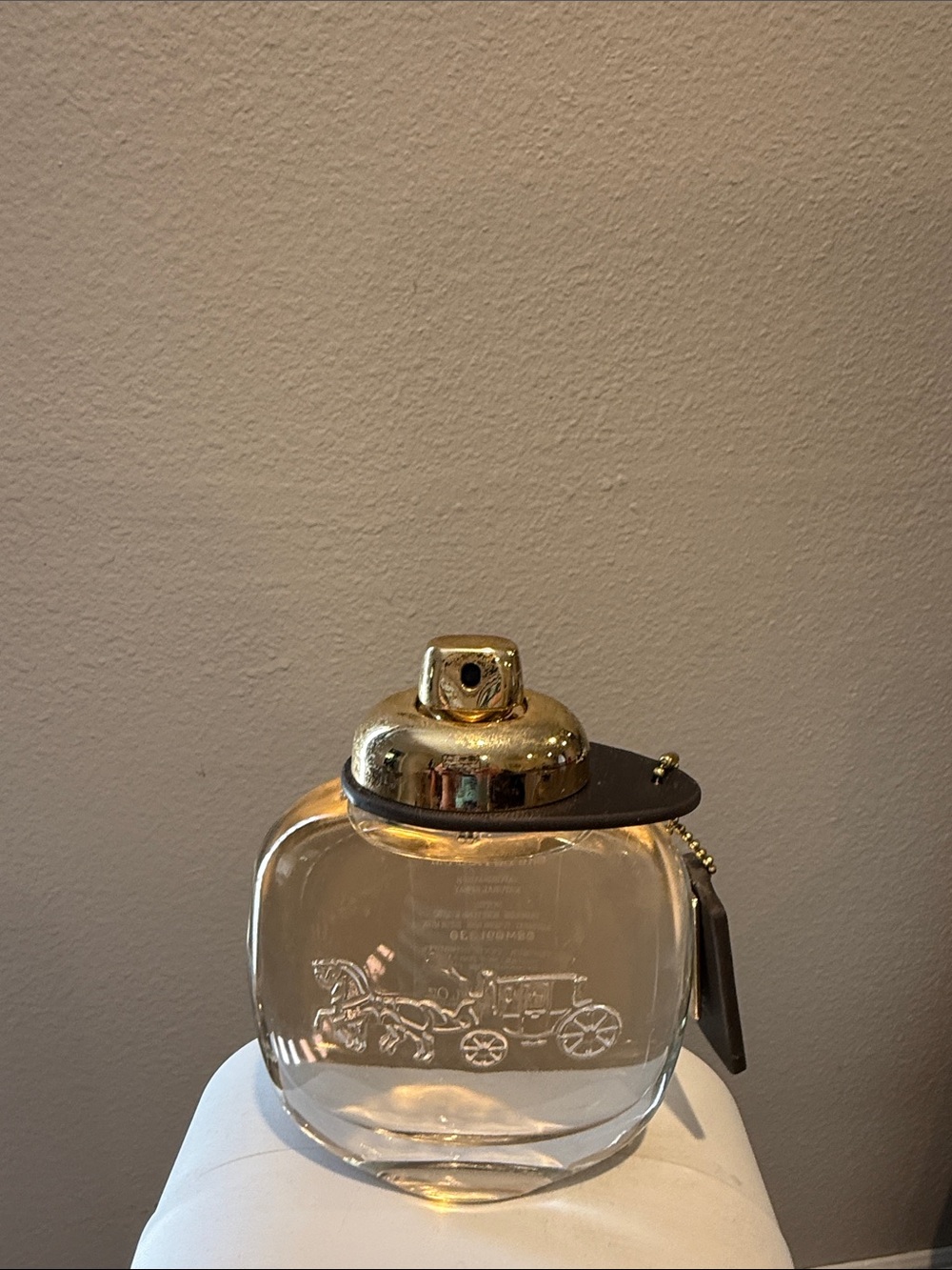 Coach Clear Glass Perfume Bottle with Gold Top and Black Tag
